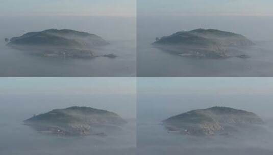 航拍山东省威海市平流雾中的褚岛高清在线视频素材下载