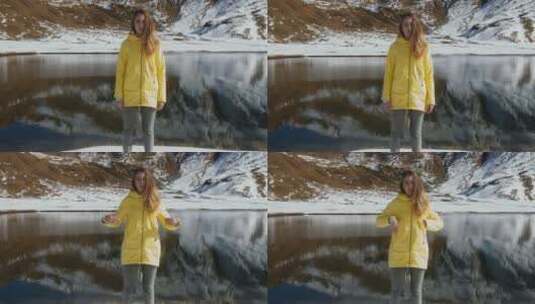 站在雪山湖边的女人高清在线视频素材下载