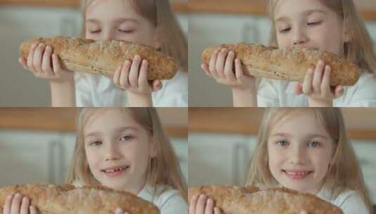 女孩拿起面包放在鼻尖嗅高清在线视频素材下载