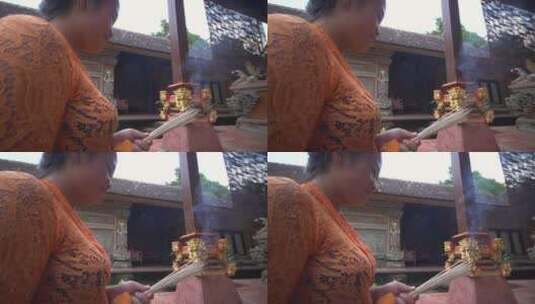 一名妇女在寺庙烧香高清在线视频素材下载
