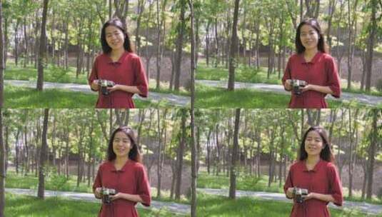 春天中国女性美女在公园拍照高清在线视频素材下载