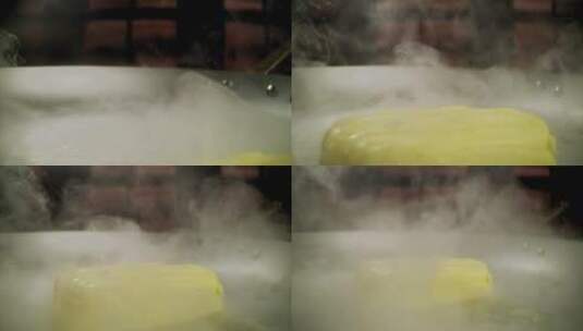 一块黄油在热板上融化的特写高清在线视频素材下载