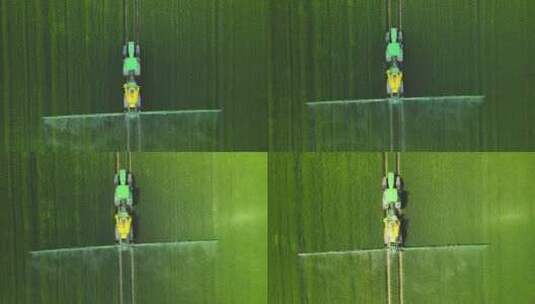 航拍拖拉机在农田里施肥喷洒农药高清在线视频素材下载