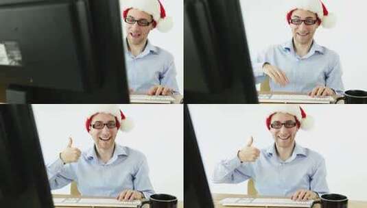带圣诞帽子的男人在工作高清在线视频素材下载