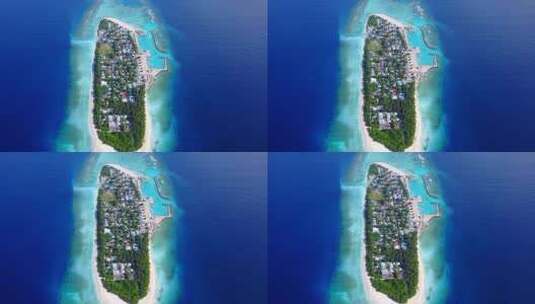 4K白色沙滩天堂海滩和蓝色海洋背景的日间俯瞰岛屿景观高清在线视频素材下载