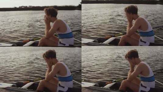 男性划手在湖上的船上哭泣高清在线视频素材下载