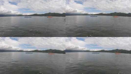 泸沽湖水中视角的猪槽船与水性杨花高清在线视频素材下载