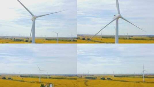 风力发电机和金黄色的水稻田高清在线视频素材下载