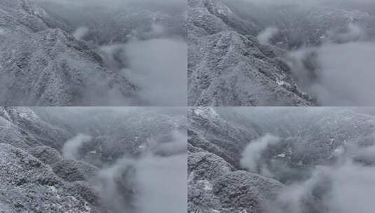 雪覆山峦云雾缭绕景象高清在线视频素材下载