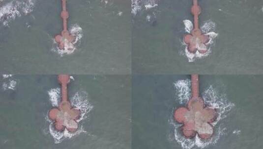 航拍俯瞰山东威海高区金海湾栈桥的海浪4K高清在线视频素材下载