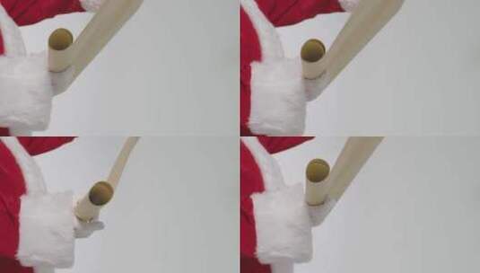 圣诞老人手握卷轴高清在线视频素材下载