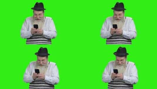 老人在绿屏前使用手机 高清在线视频素材下载