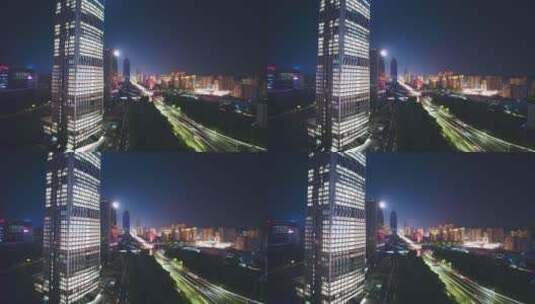 航拍夜晚杭州滨江灯火通明的现代办公大楼高清在线视频素材下载