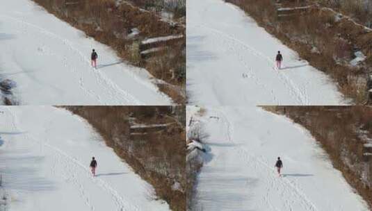 航拍东北冬天雪地行走，滑冰高清在线视频素材下载