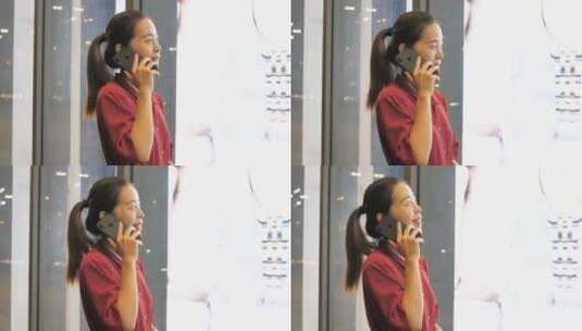 亚洲东方中国女性在商场玩手机沟通联系高清在线视频素材下载