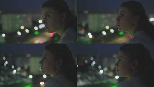 年轻女子在欣赏城市夜景高清在线视频素材下载