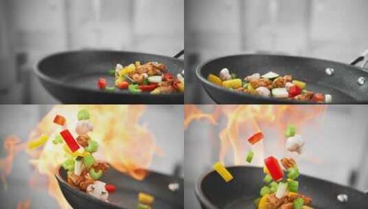 平底锅大火爆炒蔬菜的慢镜头特写高清在线视频素材下载
