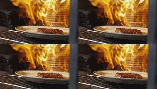 火焰牛排拖出烤箱高清在线视频素材下载