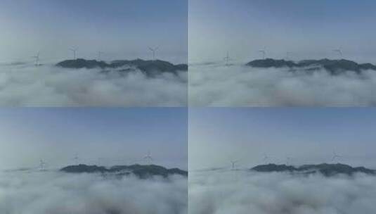 清晨山峰上的风力发电机组与云海仙境航拍高清在线视频素材下载