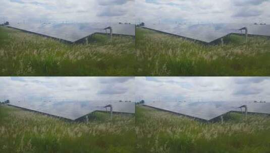 平静和安静的太阳能光伏组件在太阳能农场和草地上产生清洁能源高清在线视频素材下载