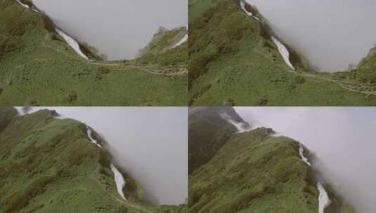 航拍一半云雾一半丛林的山脉高清在线视频素材下载