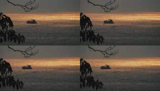 日落光影海洋上的船只高清在线视频素材下载