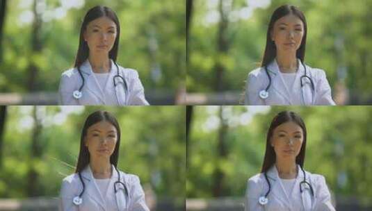 自信的护士在医院公园里看着摄像机，医疗职高清在线视频素材下载