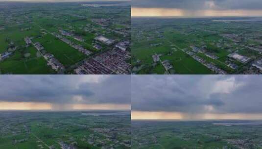 航拍平原地区局部下雨暴雨雨幕夕阳乌云高清在线视频素材下载