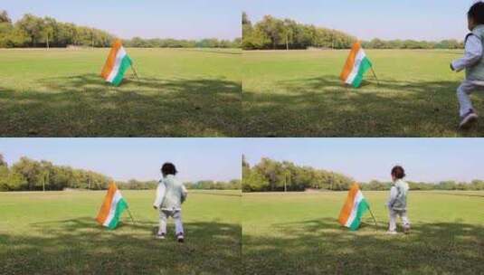 白天，孩子们拿着印度三色国旗在绿色运动场高清在线视频素材下载