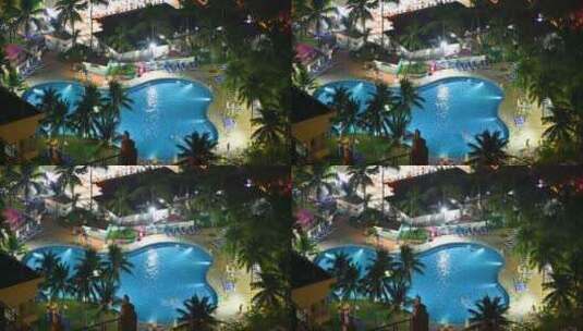 航拍旅游度假区蓝色游泳池夜景高清在线视频素材下载