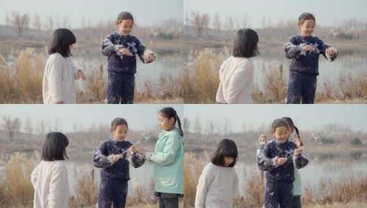 冬季在公园湖边游玩的三个中国女孩高清在线视频素材下载