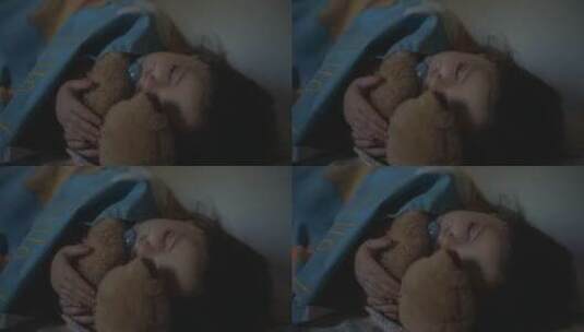 小女孩抱着娃娃睡觉高清在线视频素材下载