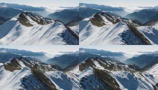 夹金山冬季航拍白雪覆盖山脊高清在线视频素材下载