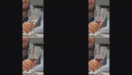 把酒倒在男人的杯子里高清在线视频素材下载
