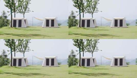 阳光下草地上露营的帐篷航拍高清在线视频素材下载