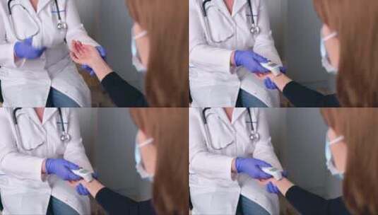 高加索医生正在测量一个戴面具的女人的体温高清在线视频素材下载
