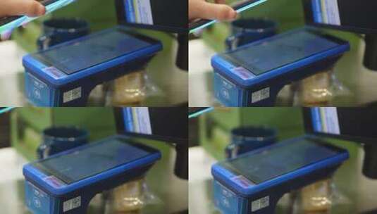 女性在超市使用扫码支付手机支付无线科技高清在线视频素材下载