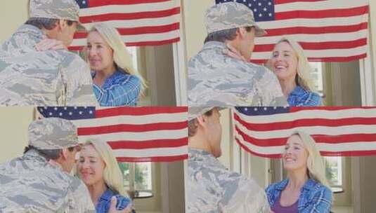高加索男士兵在美国国旗上拥抱他微笑的妻子高清在线视频素材下载
