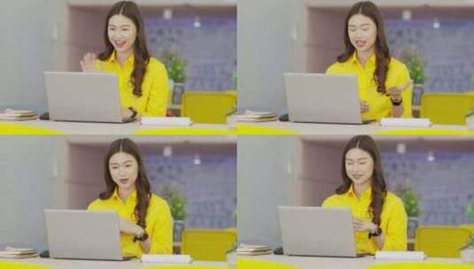 年轻的亚洲女商人穿着黄色衬衫开会在线视频电话会议高清在线视频素材下载