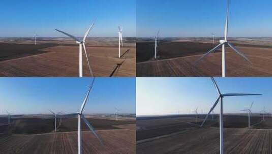白天风电场上的大型白色风力涡轮机高清在线视频素材下载