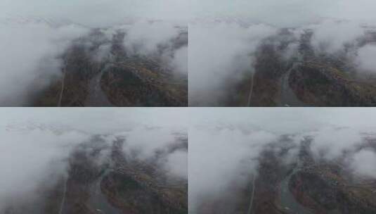 航拍秋天晨雾中的新疆禾木村风景高清在线视频素材下载