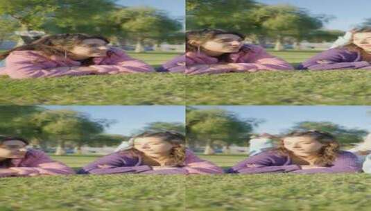 穿着旱冰鞋的女孩躺在阳光下的草地上和聊天高清在线视频素材下载