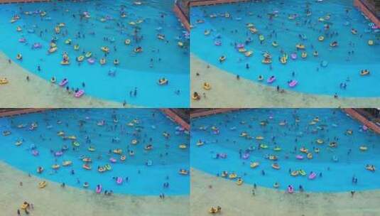 航拍夏天武汉欢乐谷水上乐园游泳池的人群高清在线视频素材下载