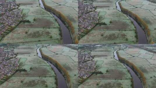 无人机拍摄一个居民区后面的农田高清在线视频素材下载