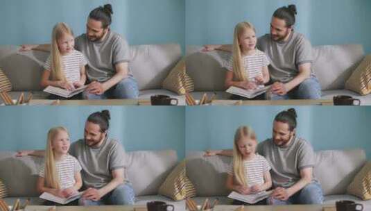 女孩和父亲一起看书高清在线视频素材下载