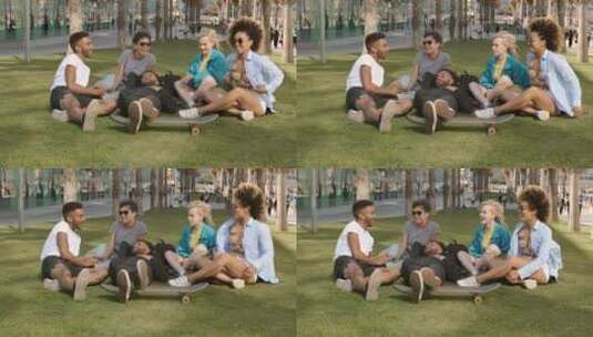 一群朋友坐在公园的草坪上说笑高清在线视频素材下载