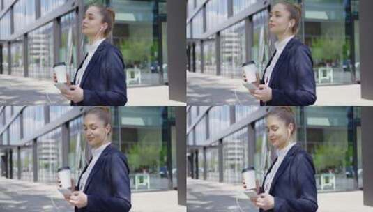 女人使用手机手拿咖啡高清在线视频素材下载