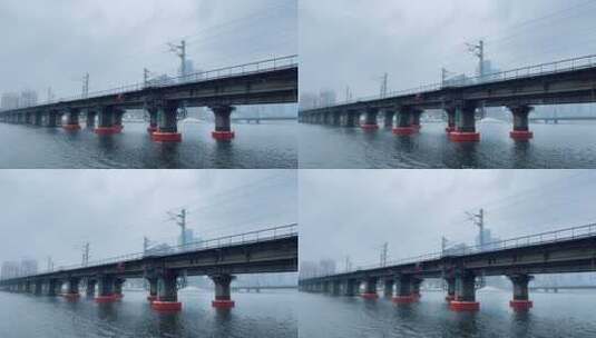 铁路桥河流下雪过火车高清在线视频素材下载