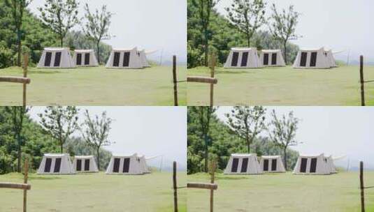 阳光下草地上露营地帐篷航拍高清在线视频素材下载