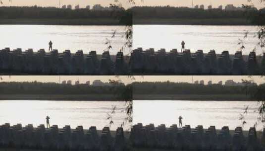 河边拍照的游客【剪影】高清在线视频素材下载